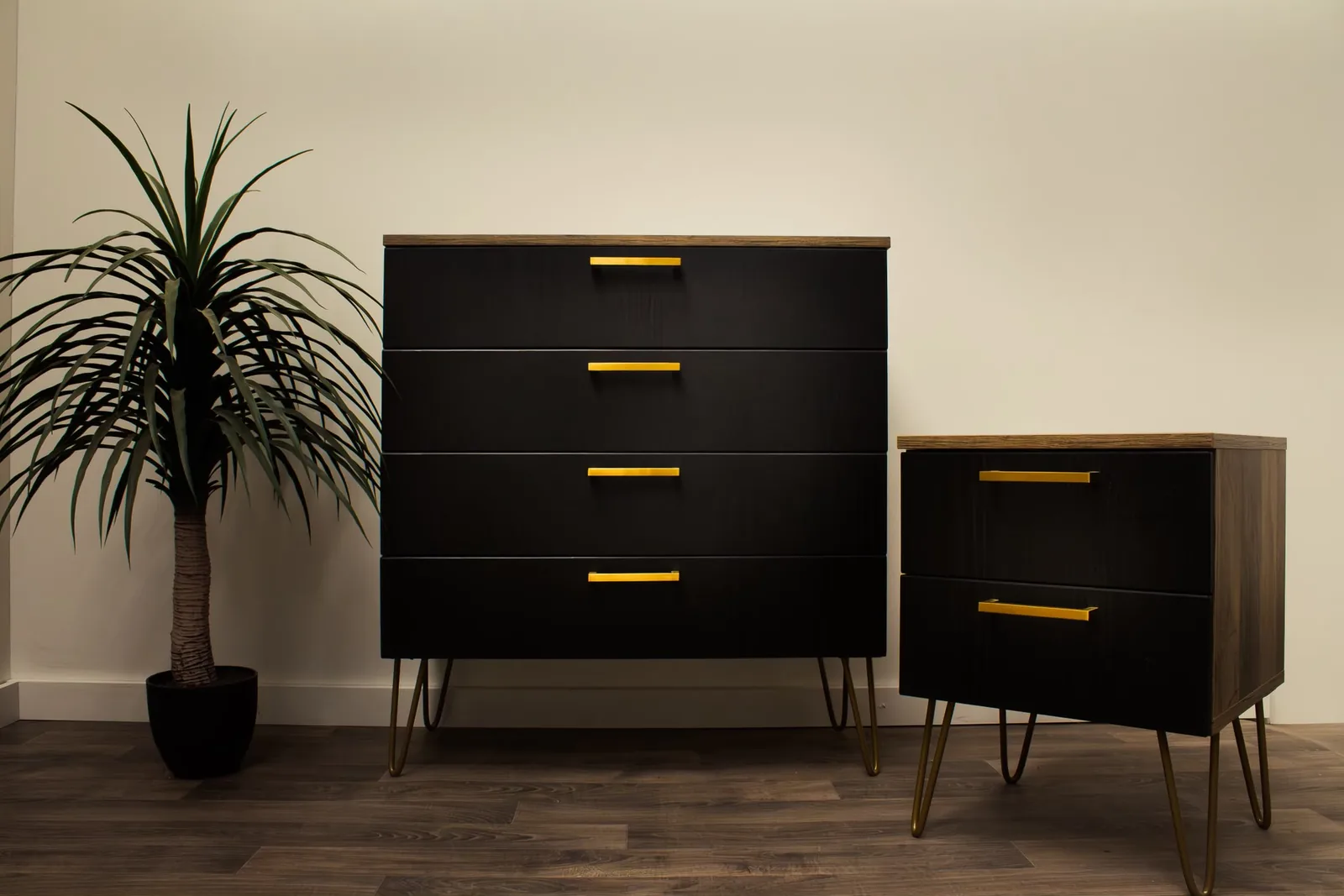 Black chest of drawers and bedside unit with antique gold handles, made by Superio